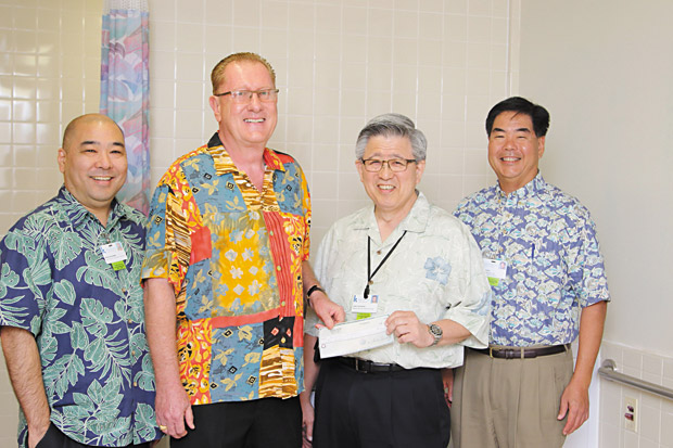 Pictured are: (from left) Brian Nagamine, manager, development, Kuakini Foundation; Charlie Beeck, president of Tropical Plumbing & Bath; Gary Kajiwara, president and CEO, Kuakini Health system; and Gregg Oishi, senior vice president and chief administrative officer, Kuakini Health System. PHOTO BY PHIL SPALDING III 