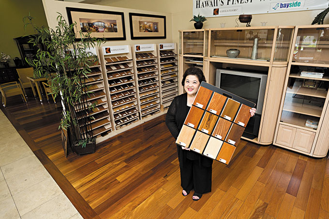 Owner Shirley Pai Hilton with Kahala Floors brand engineered flooring samples